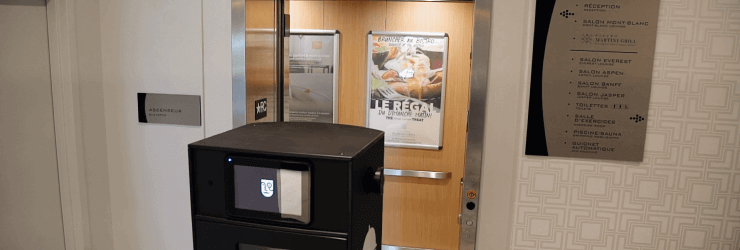 The delivery robot is ready to enter an elevator.